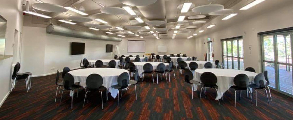 Chairs and tables set up in the event room